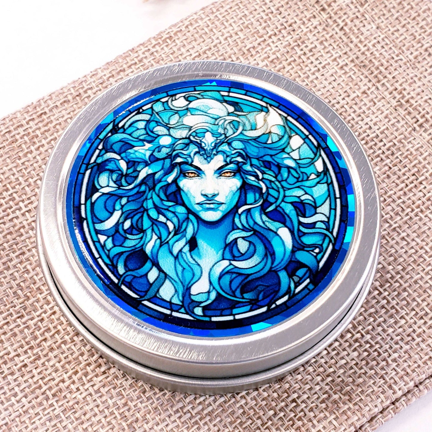 Medusa Gift Container. Small round metal tin with Medusa the mythological Greek goddess in blue graphics. Stocking Stuffer gift for her.
