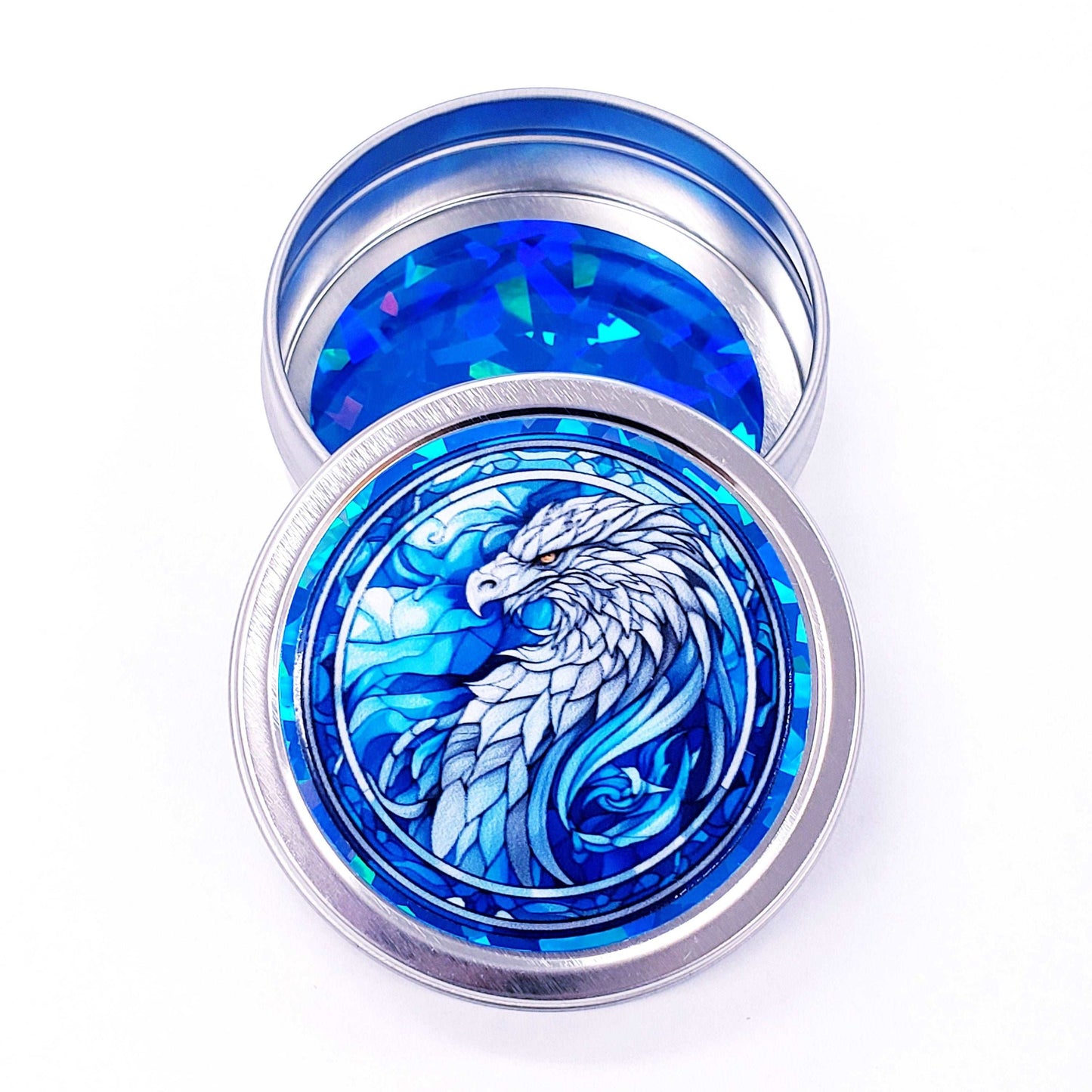 Griffin Container. Small round metal tin with blue mythological griffin eagle graphics. Stocking stuffer gift.