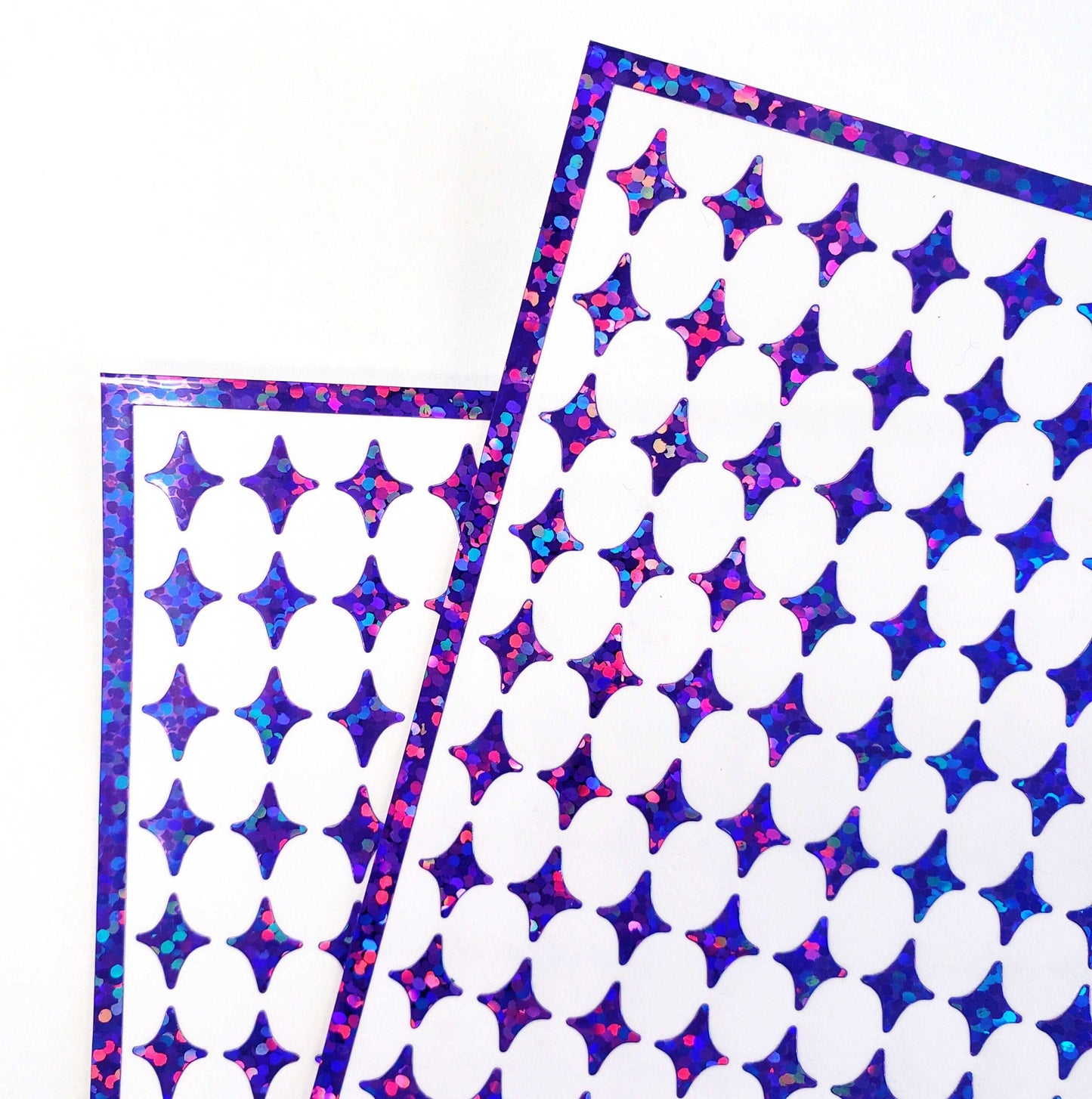 Purple Four-Pointed Stars Sticker Sheet.