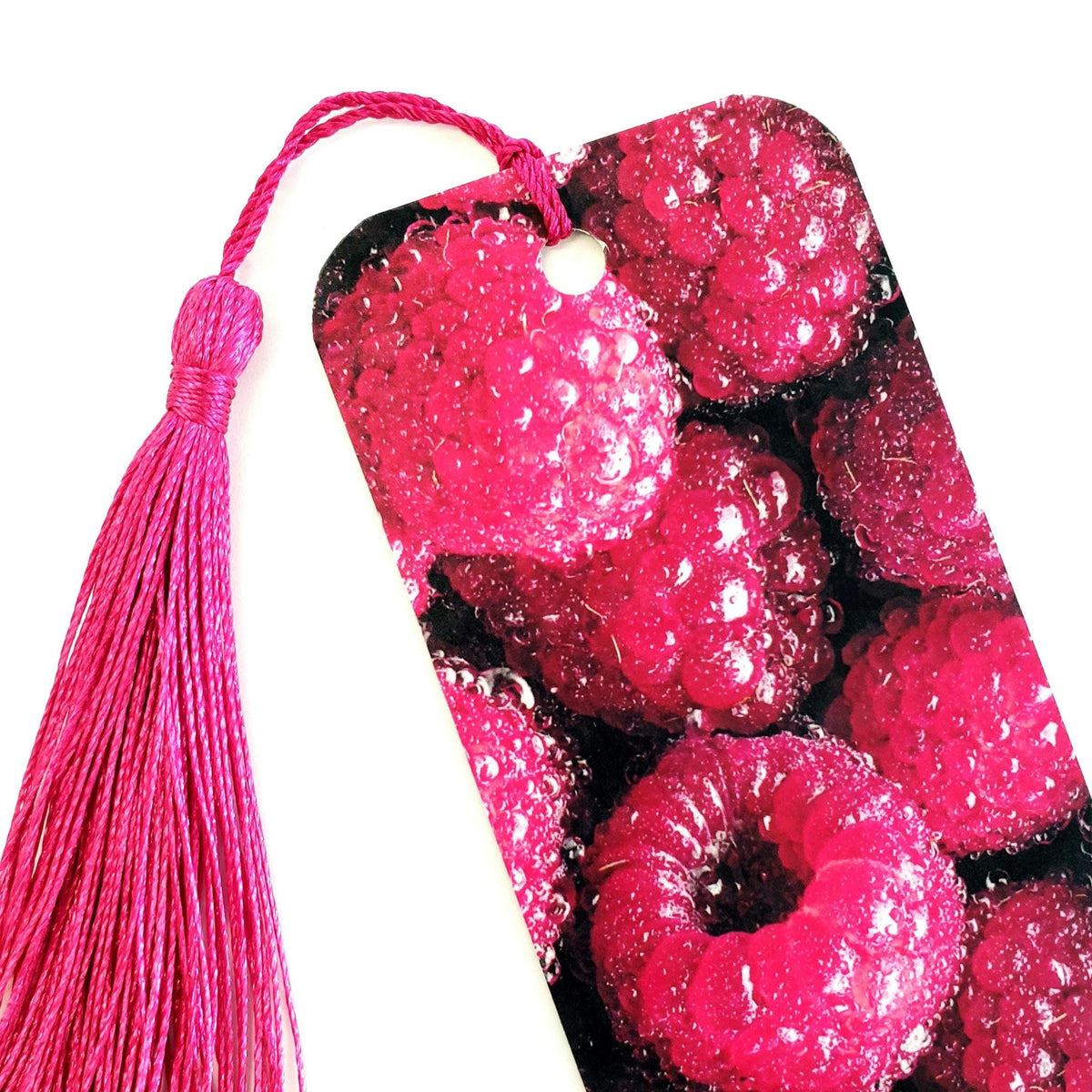 Raspberry bookmark with hot pink tassel. double-sided bookmark with photograph of raspberries.