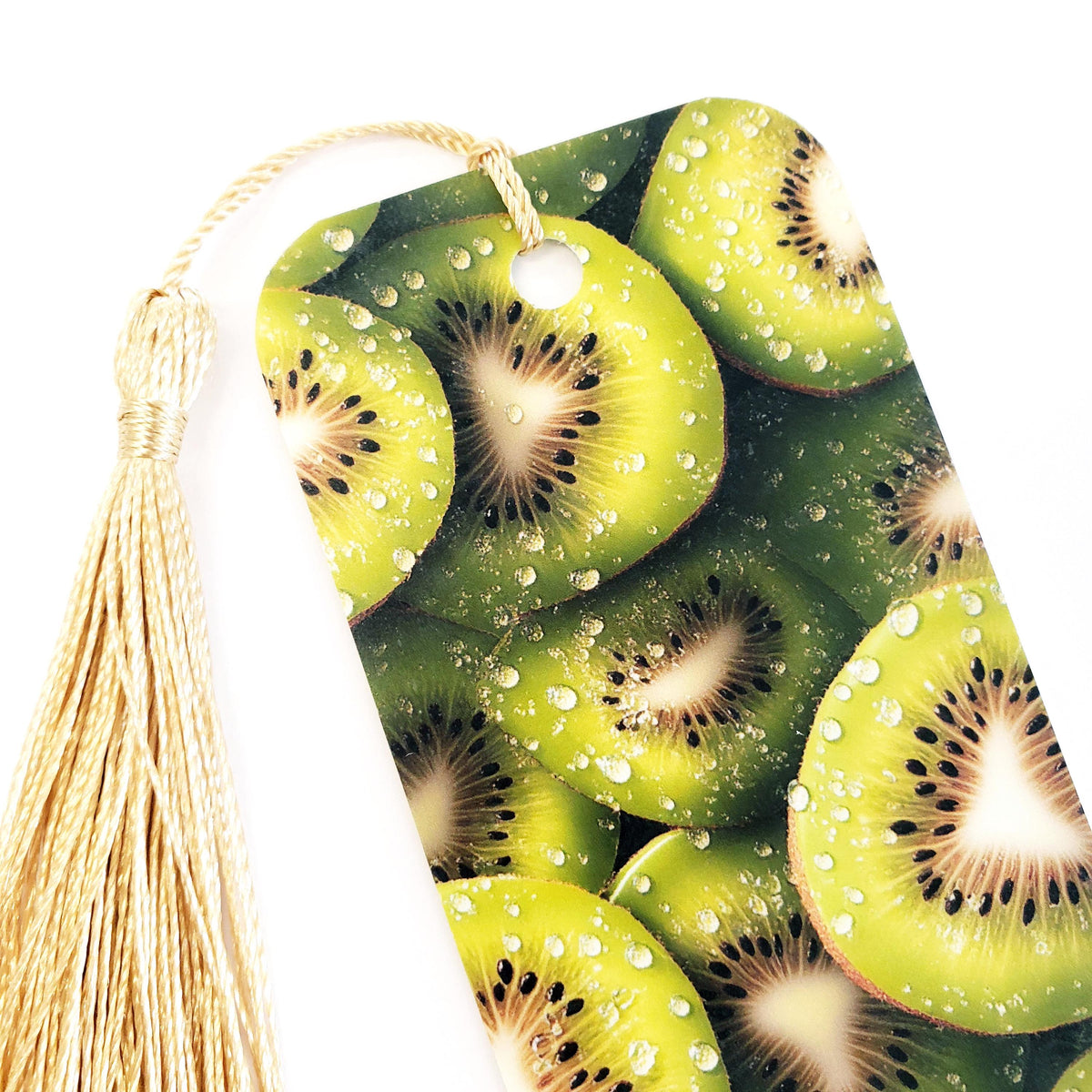Kiwi fruit bookmark with  gold tassel. double-sided bookmark with photograph of sliced kiwi fruit.