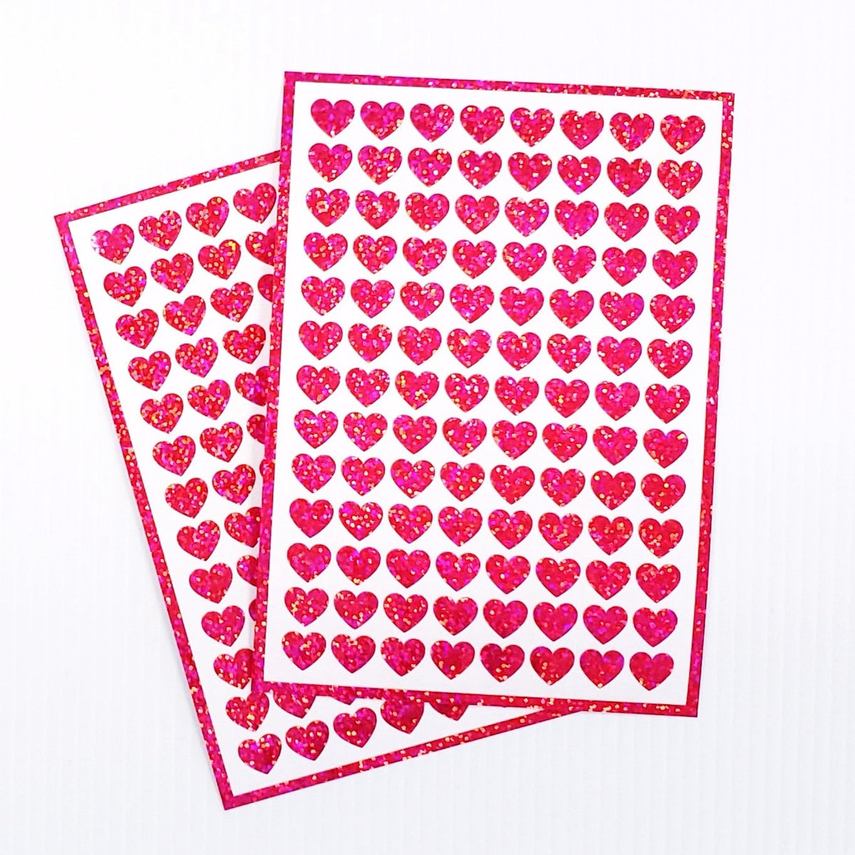 Pink Hearts Sticker Sheet. Set of 104 sparkly vinyl heart decals for planners, notebooks, journals, charts and crafts. Half inch hearts.