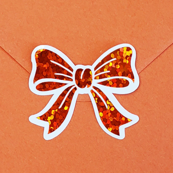 Set of 20 sparkly orange bow shaped stickers