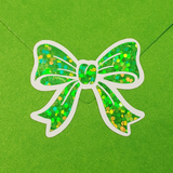 Set of 20 sparkly green bow stickers.
