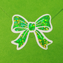 Set of 20 sparkly green bow stickers.