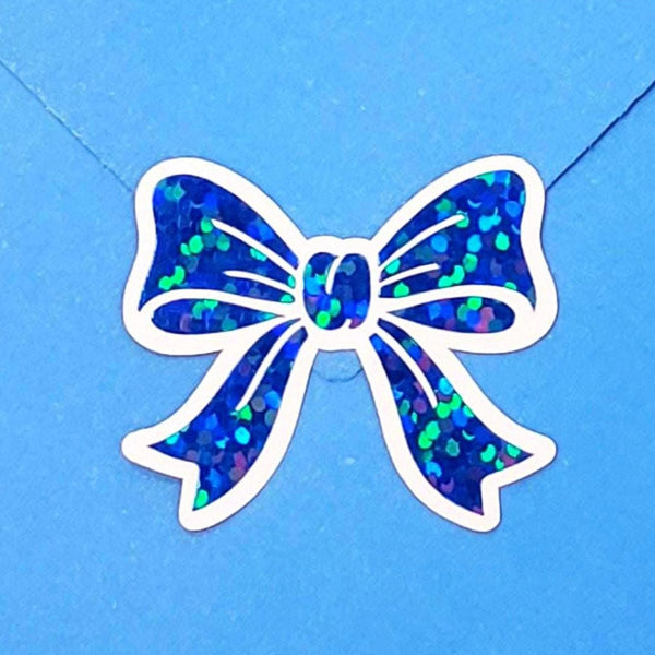 Bright blue bow stickers. Sheet of 20 individual peel and stick sparkly ribbon shaped decals.