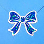Bright blue bow stickers. Sheet of 20 individual peel and stick sparkly ribbon shaped decals.