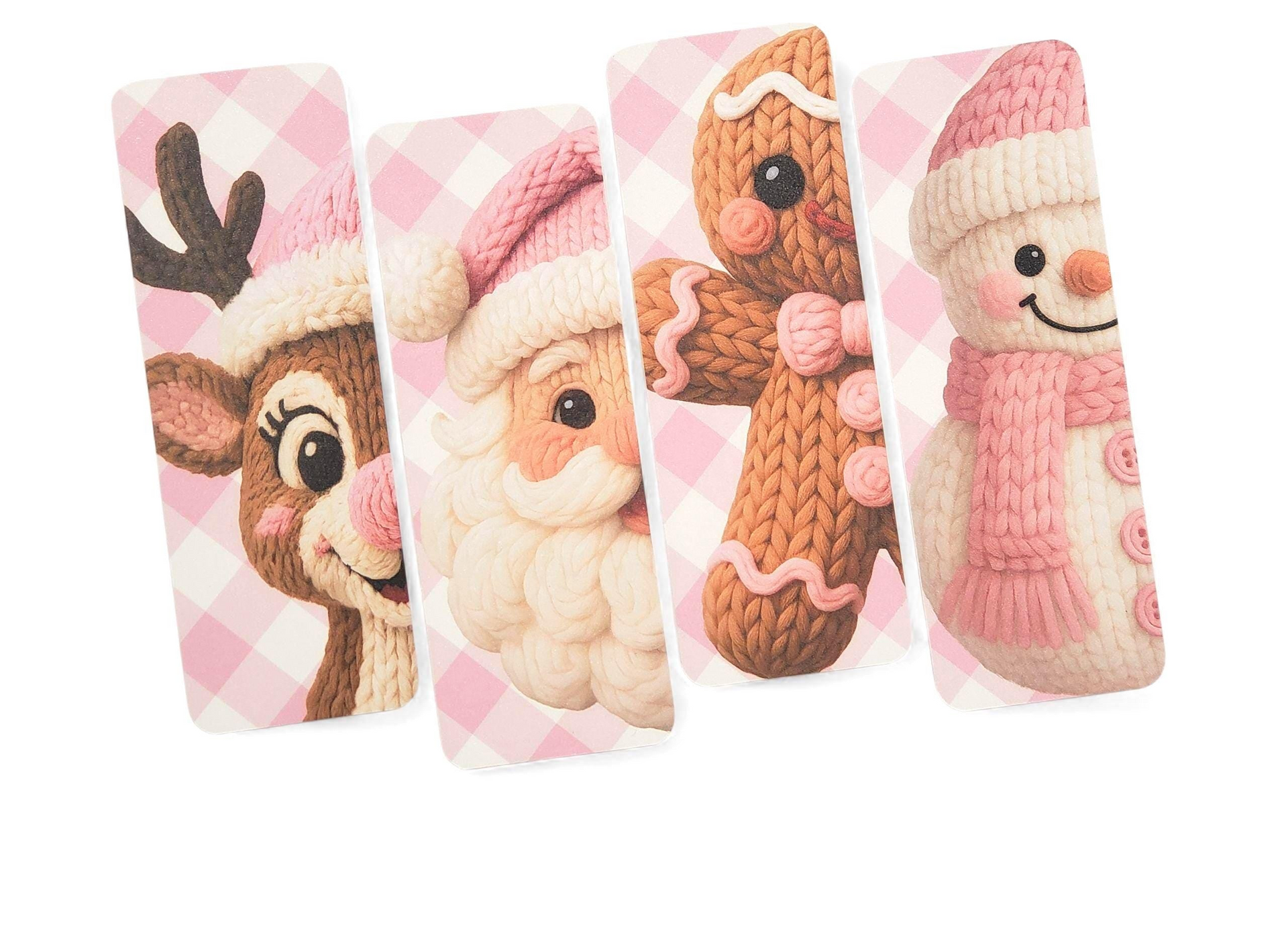  Four Christmas-themed bookmarks with reindeer, Santa Claus, gingerbread man, and snowman designs on a pink checkered background.