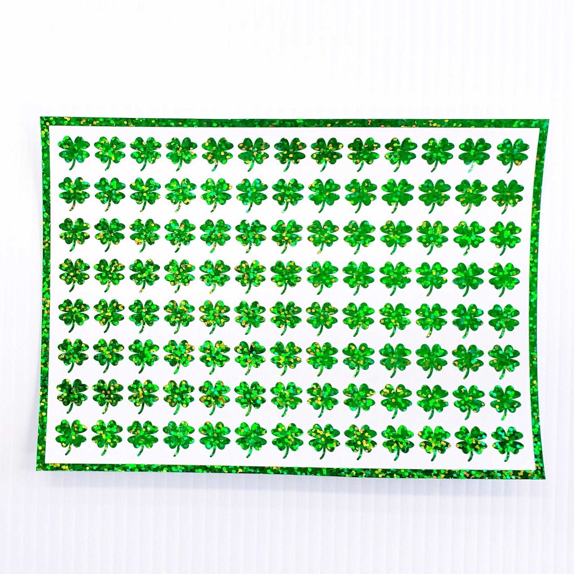 Green Clovers Sticker Sheet. Set of 104 four leaf clover glitter vinyl decals for teachers, journals and crafts. St. Patrick's Day Stickers.