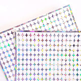 Small Silver Four-Pointed Stars Sticker Sheet. Set of 231 sparkly silver peel and stick vinyl star decals for nails, planners and ornaments.