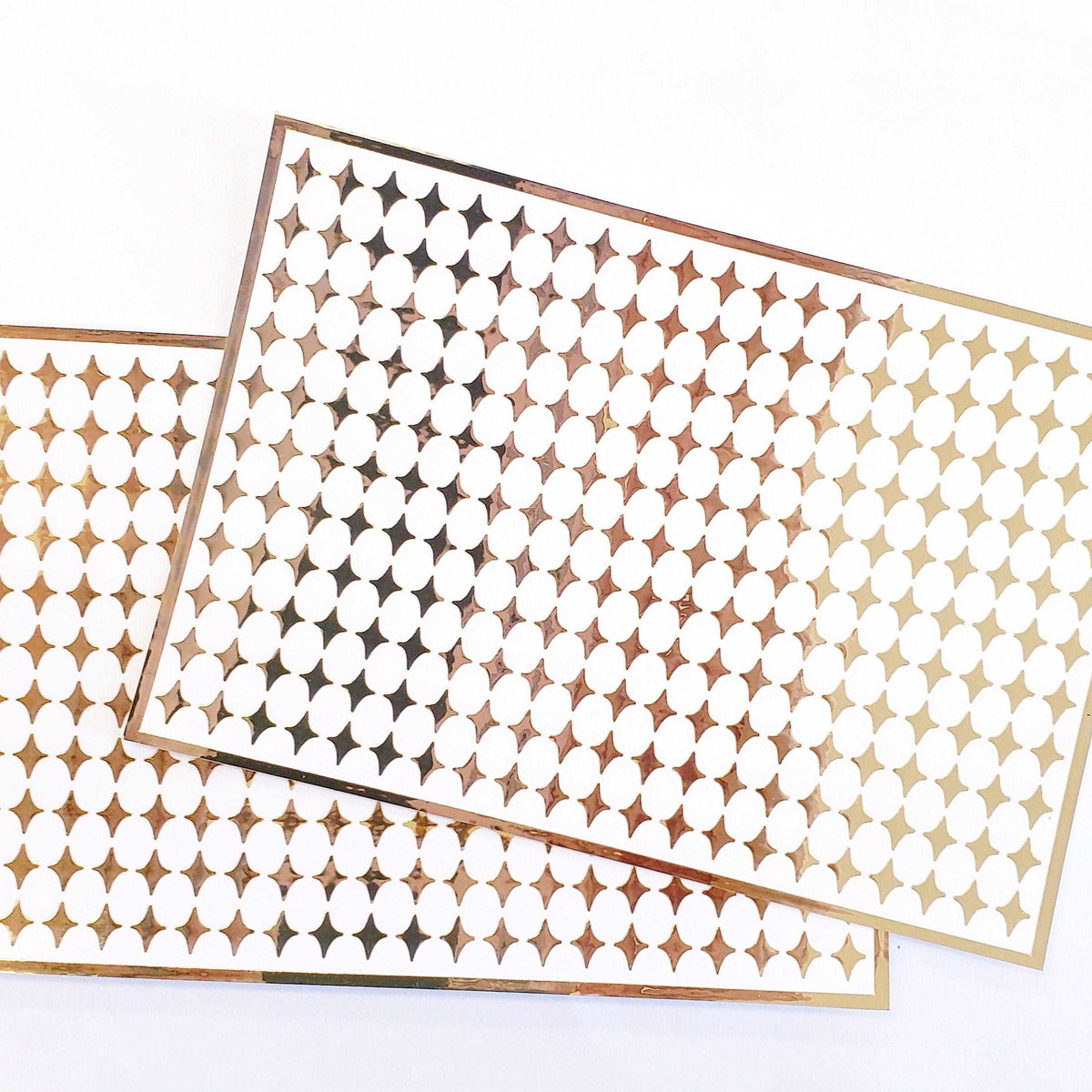 Small Gold Four-Pointed Stars Sticker Sheet. Set of 231 mirror gold peel and stick vinyl star decals for nails, planners and ornaments.