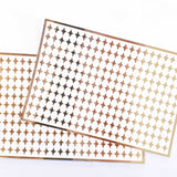 Small Gold Four-Pointed Stars Sticker Sheet. Set of 231 mirror gold peel and stick vinyl star decals for nails, planners and ornaments.
