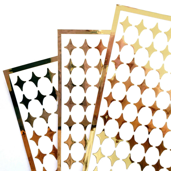Small Gold Four-Pointed Stars Sticker Sheet. Set of 231 mirror gold peel and stick vinyl star decals for nails, planners and ornaments.