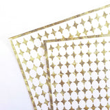 Small Gold Four-Pointed Stars Sticker Sheet. Set of 231 metallic gold peel and stick vinyl star decals for nails, planners and ornaments.
