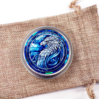 Griffin Container. Small round metal tin with blue mythological griffin eagle graphics. Stocking stuffer gift.
