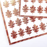 copper-colored oak leaf stickers.