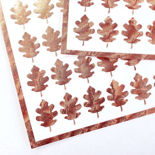 copper-colored oak leaf stickers.
