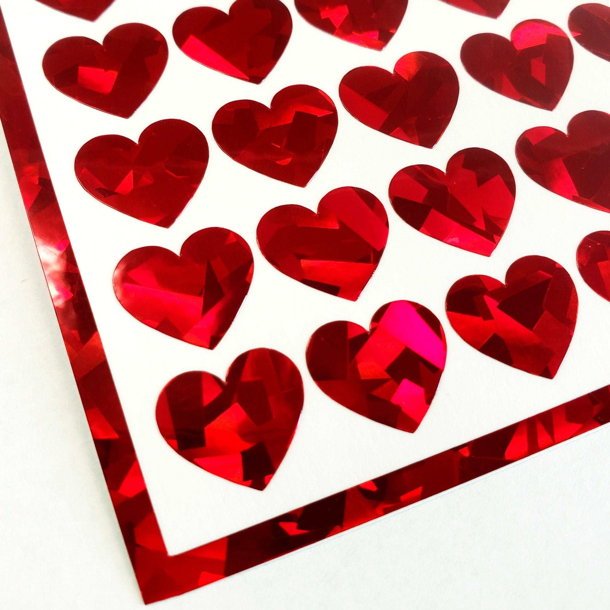Red Hearts Sticker Sheet. Set of 104 sparkly vinyl heart decals for planners, notebooks, journals, charts and crafts. Red half inch hearts.