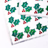 Christmas Holly Stickers, set of 20 sparkly red berry and green holly leaf stickers for holiday decor, gift tags and cards. Silver outline.