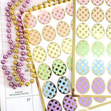 set of 30 pastel color easter egg stickers. Polka dot design with gold outline
