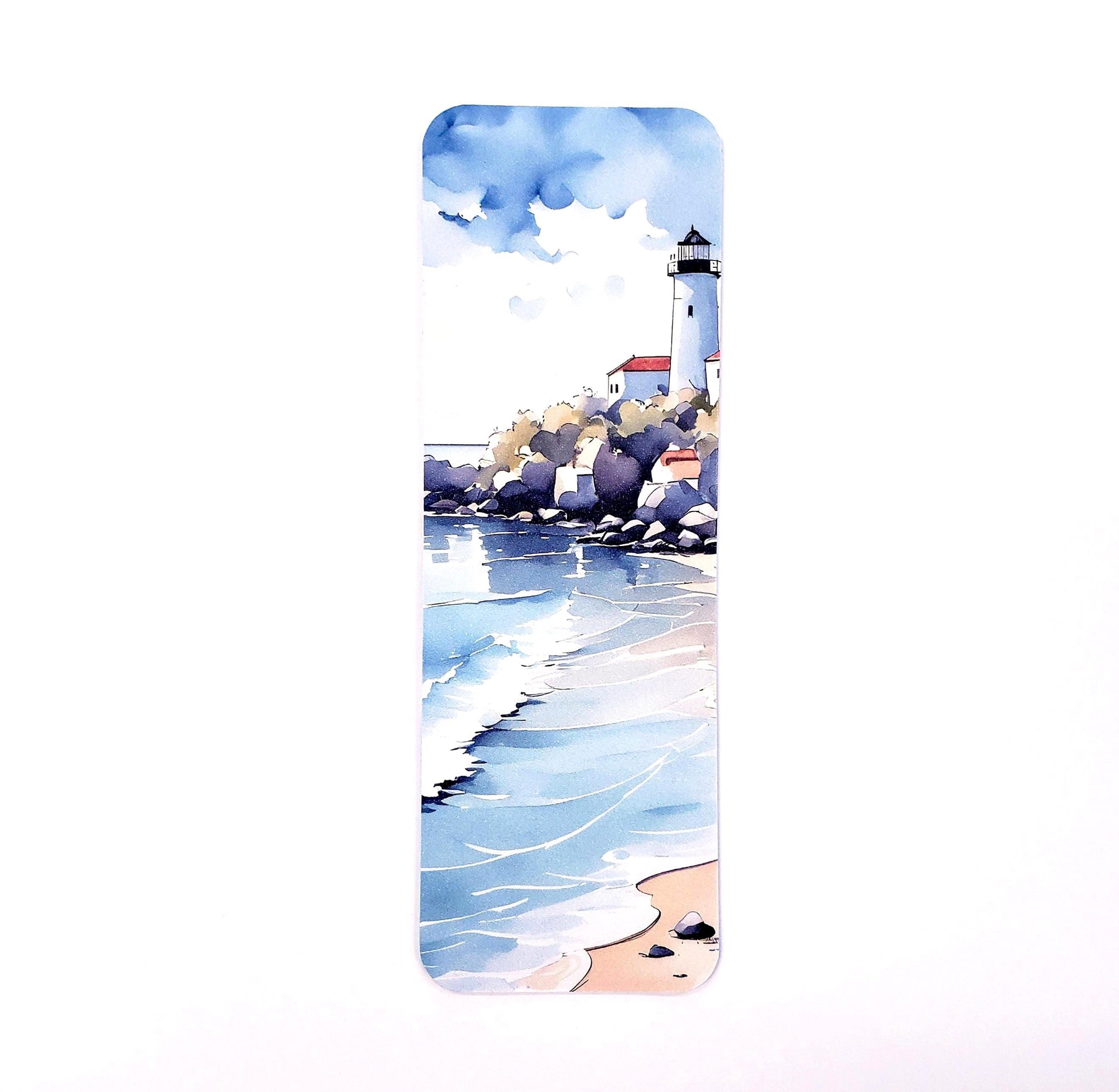 A watercolor painting of a lighthouse on a rocky shore with blue water and white waves. The lighthouse is white with a red roof and is surrounded by small buildings. The water is a light blue color and the waves are white. The sky is a light blue color with white clouds.
