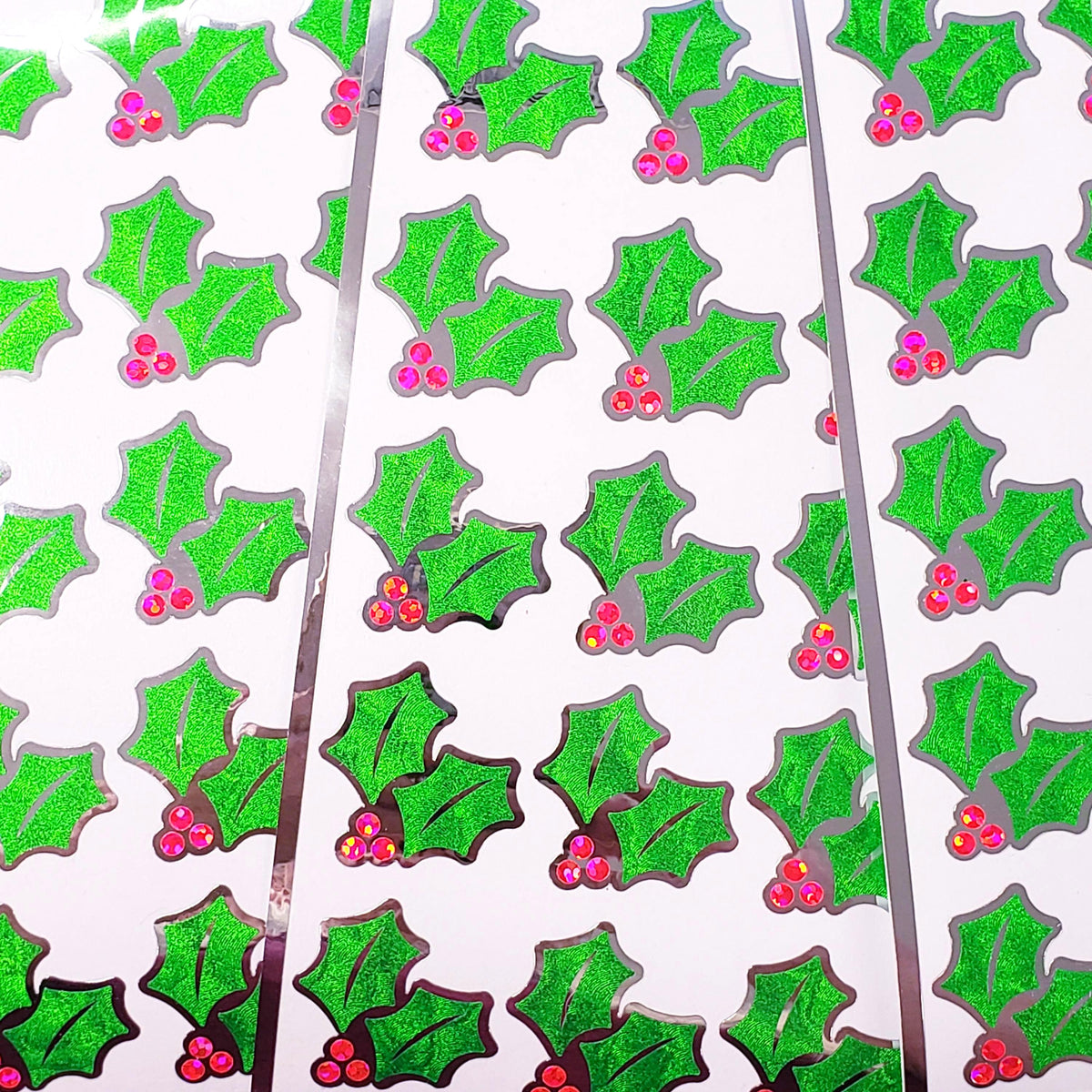 Pink Christmas Holly Stickers, set of 20 sparkly berry and green holly leaf stickers for holiday decor, gift tags and cards. Silver outline.
