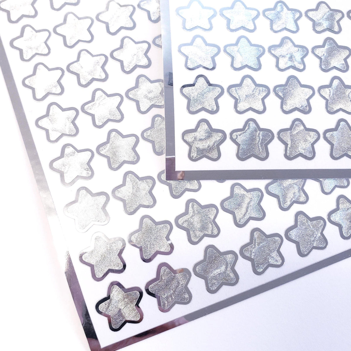 Silver Star Stickers, set of 70 small chrome silver metallic kawaii stars for cards, envelopes, invitations, laptops and crafts.
