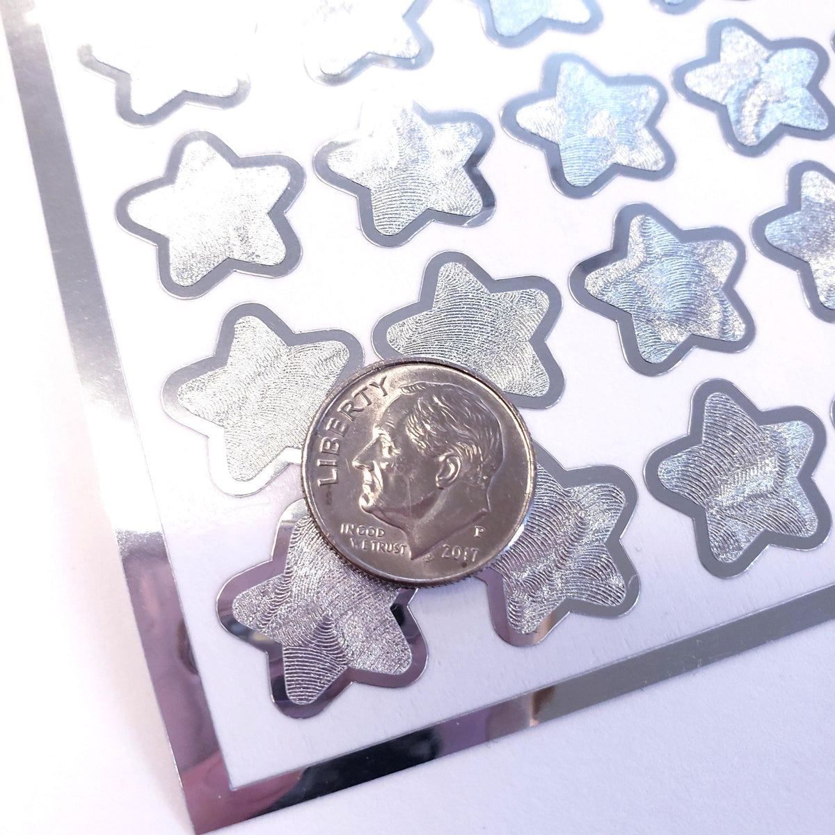 Silver Star Stickers, set of 70 small chrome silver metallic kawaii stars for cards, envelopes, invitations, laptops and crafts.