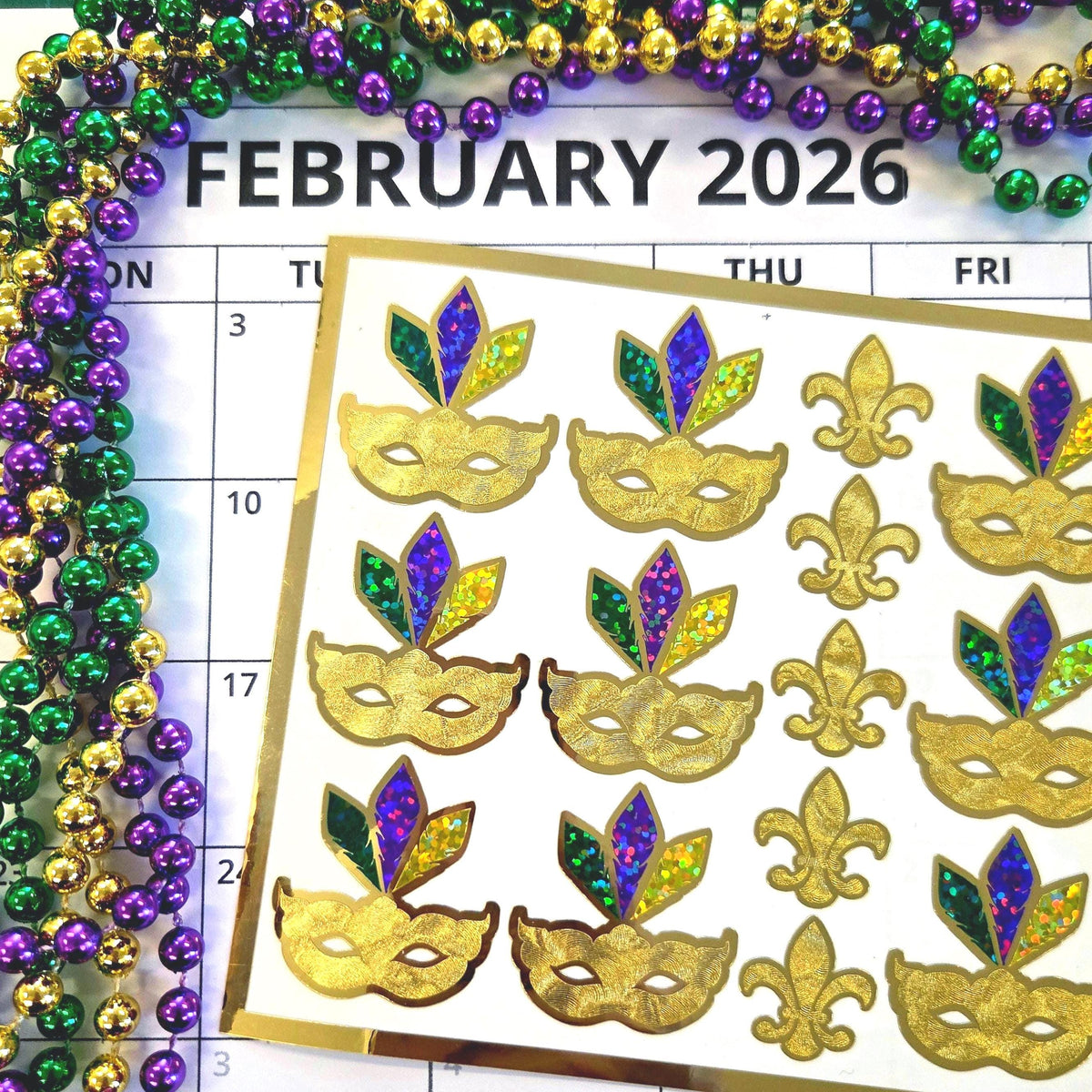 Mardi Gras Stickers, set of 12 gold purple and green sparkly mask stickers.