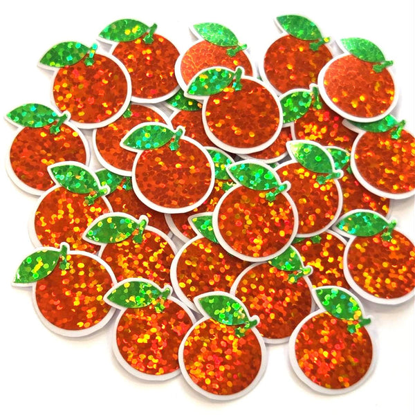 A collection of orange glittery fruit-shaped sticker embellishments with clear borders and green leaf accents. These decorative pieces are ideal for crafting projects, scrapbooking, or adding a touch of sparkle to various DIY creations. The orange fruit shapes are approximately 1 inch in diameter.