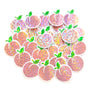 May include: A collection of peach-shaped sticker embellishments with a glittery, iridescent finish. Each peach has a green leaf and a clear border. The peaches are a mix of pink and orange hues, creating a shimmering effect.