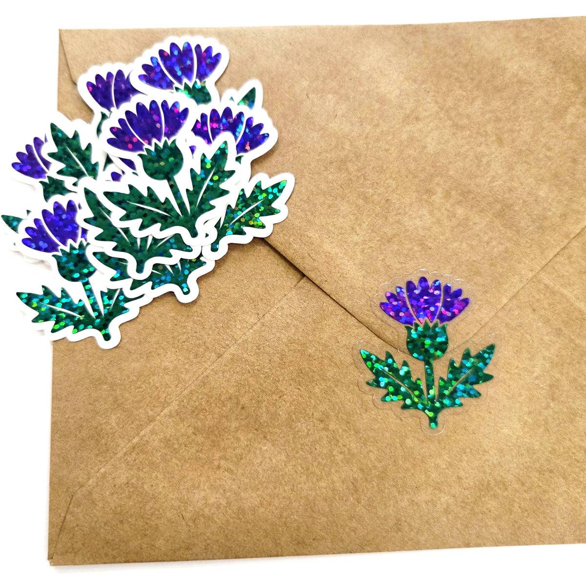 thistle flower stickers on brown envelope