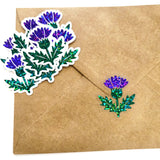 thistle flower stickers on brown envelope