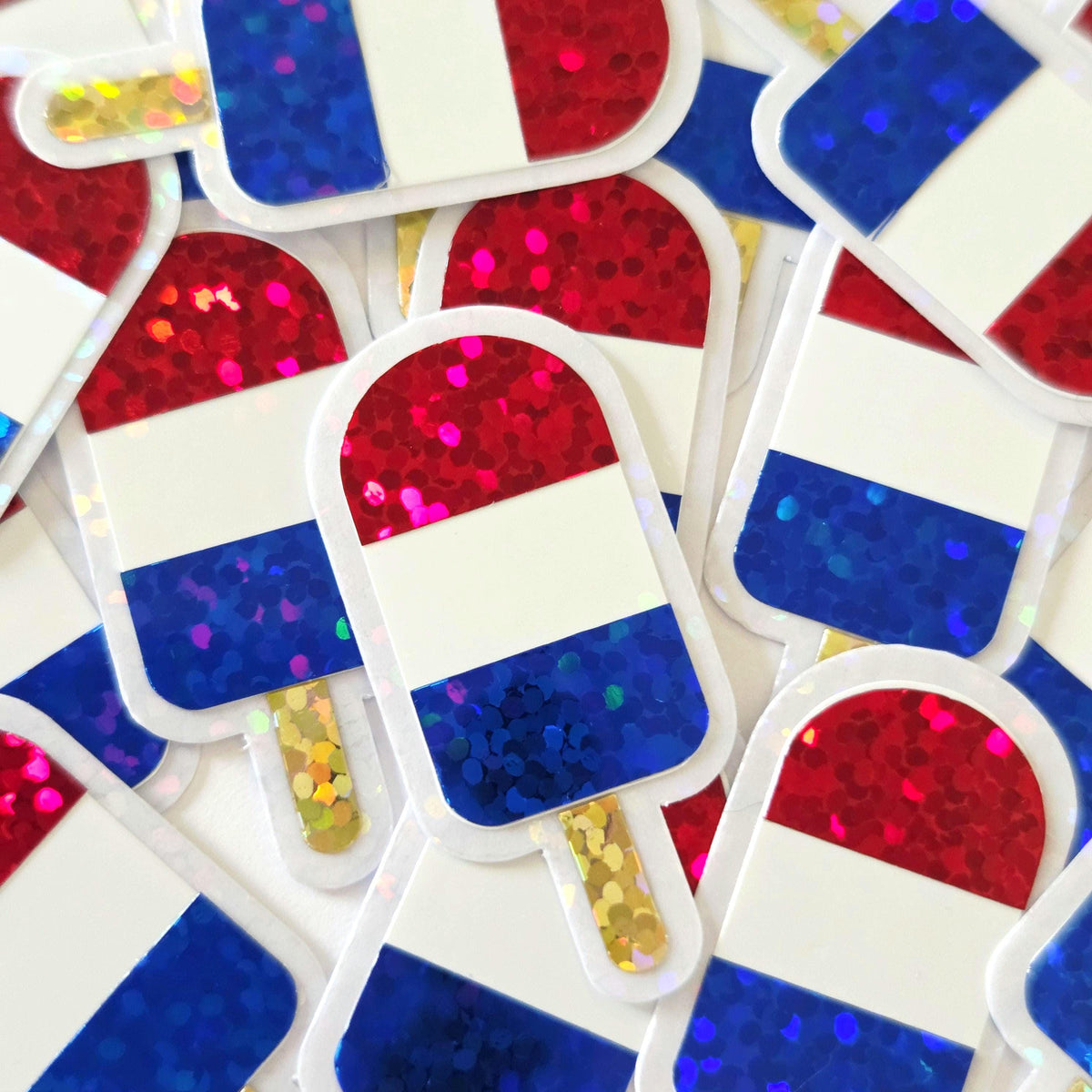 Mini American Flag Popsicle Die Cut Stickers, set of 12 in sparkly red, white and blue colors for Independence Day crafts.
