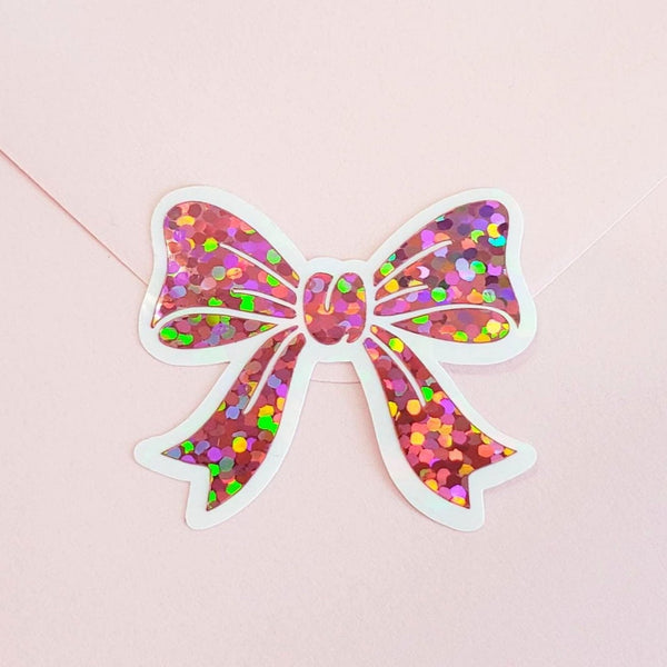Light pink sparkly bow shaped stickers. Sheet of 20 peel and sticker bows for envelopes and notecards.