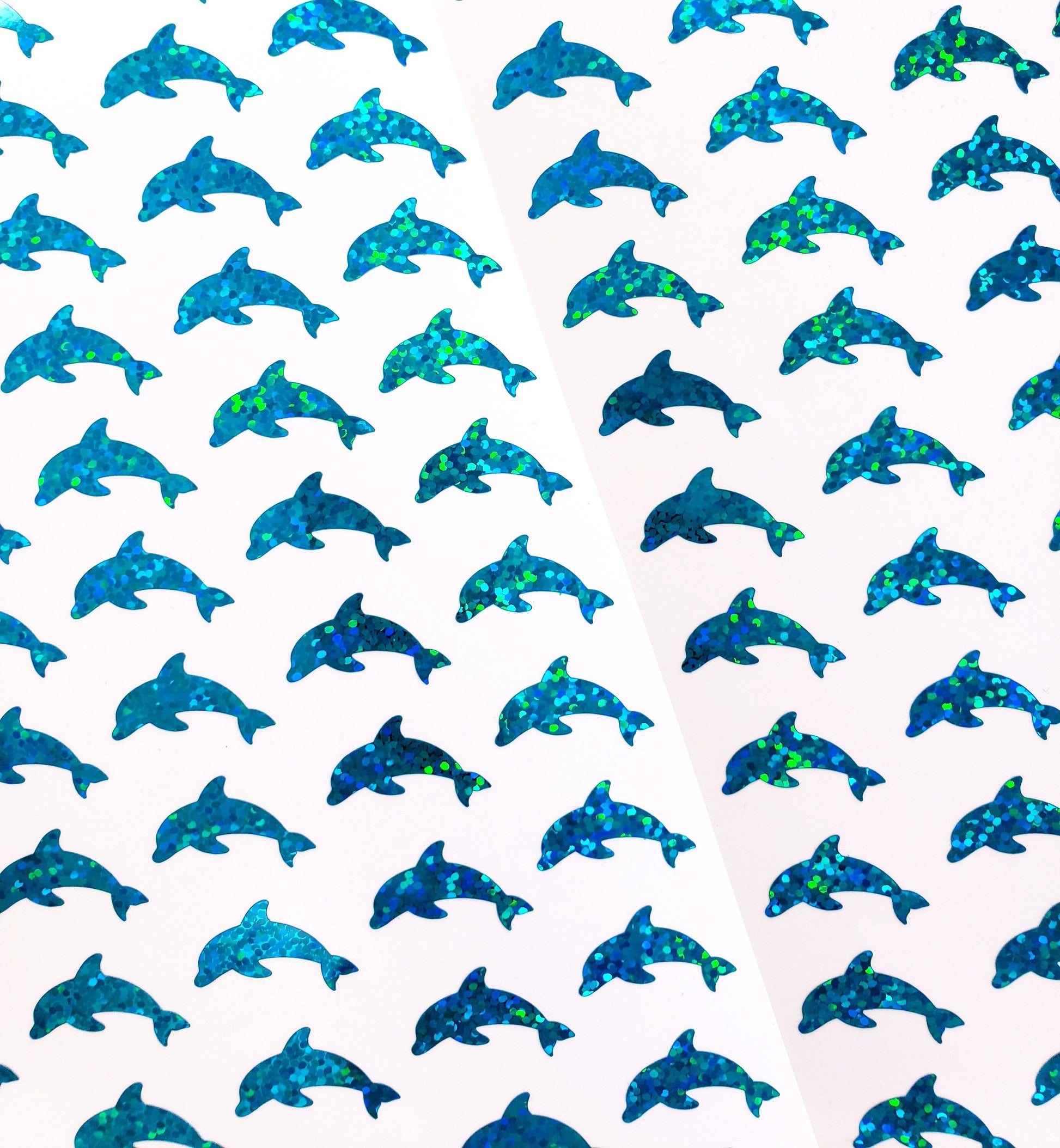 Small dolphin shaped glitter stickers in turquoise vinyl.