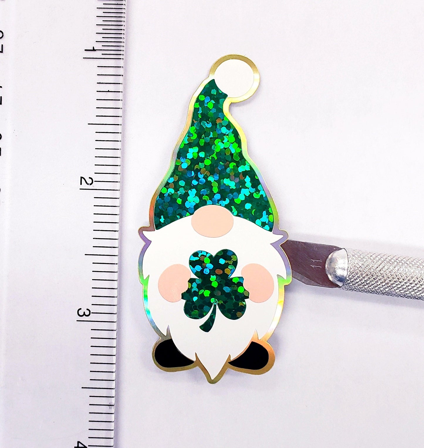 St. Patrick's Day Gnome Sticker, green and white gnome with shamrock, lucky gnome vinyl decal, sparkly glitter sticker for cards and laptops