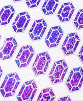 
              Purple gemstone stickers, set of 36 small sparkly purple gem shaped vinyl decals. Treasure jewel stickers for gamers.
            