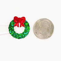 
              Christmas Wreath Stickers, set of 48 small glitter green wreath vinyl decals for holiday card envelopes, ornaments, gift tags and crafts.
            