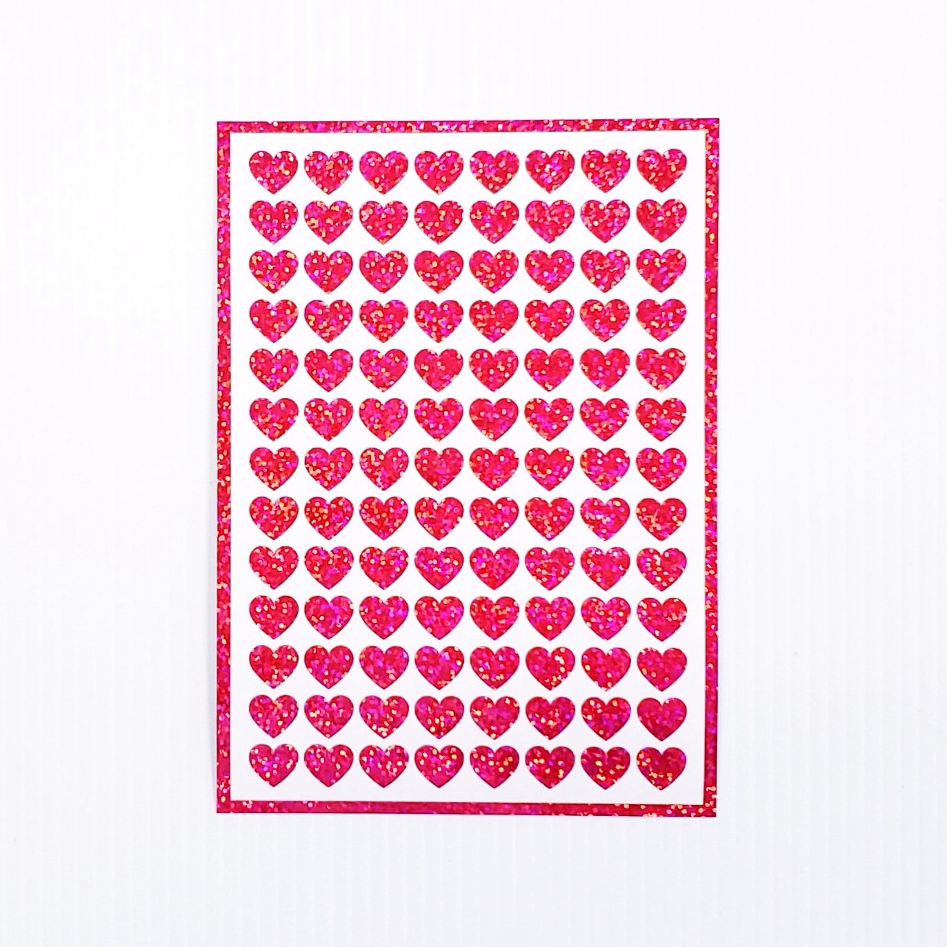 Pink Hearts Sticker Sheet. Set of 104 sparkly vinyl heart decals for planners, notebooks, journals, charts and crafts. Half inch hearts.
