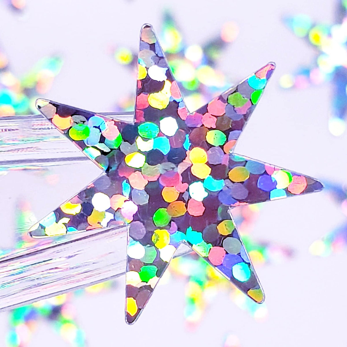 Seven Pointed Starburst Sticker Sheet, set of 48 sparkly star stickers for ornaments, journals, planners, gift tags and craft projects.